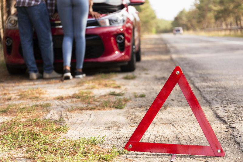 red-triangle-sign-on-the-road-for-car-problems-while-traveling.jpg