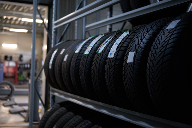 brand-new-big-variety-of-car-s-tyres-on-shelf-with-prices-at-store-or-warehouse.jpg