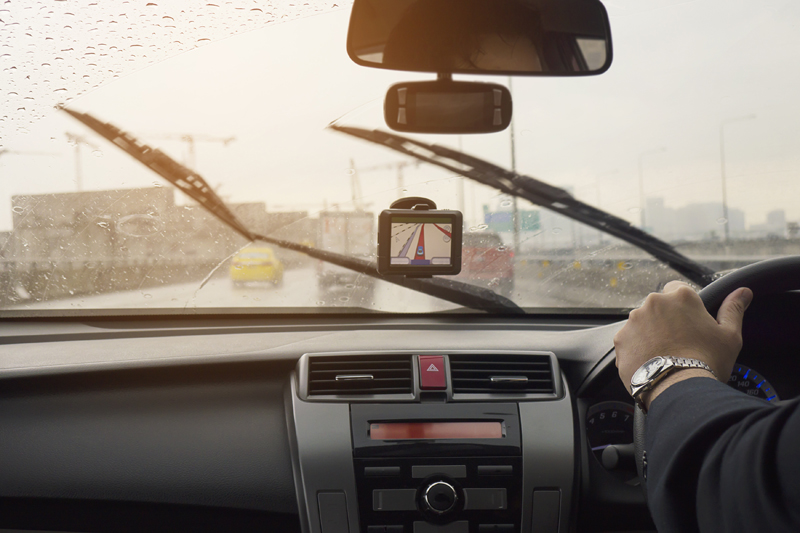business-man-is-driving-a-car-in-raining-day-with-moving-wiper-blades.jpg