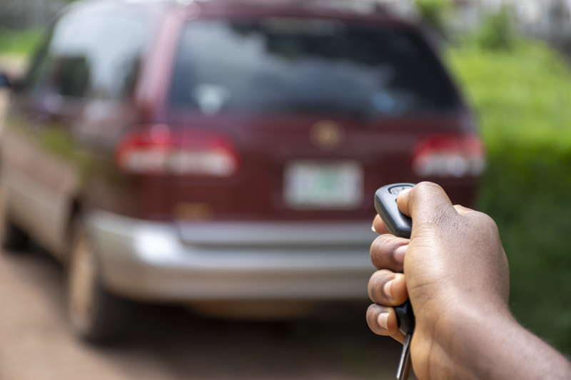 black-person-using-a-car-remote-to-unlock-a-car.jpg