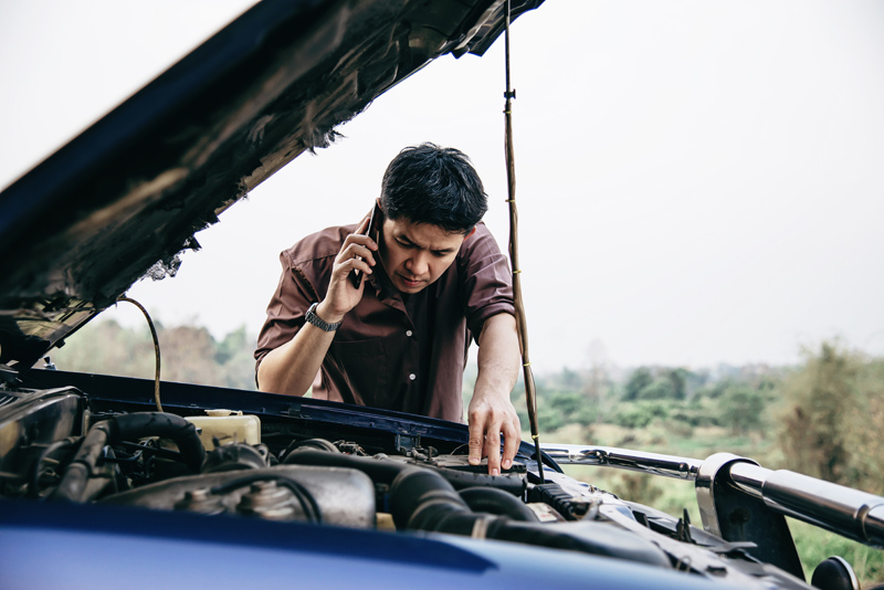 man-try-to-fix-a-car-engine-problem-on-a-local-road (1).jpg