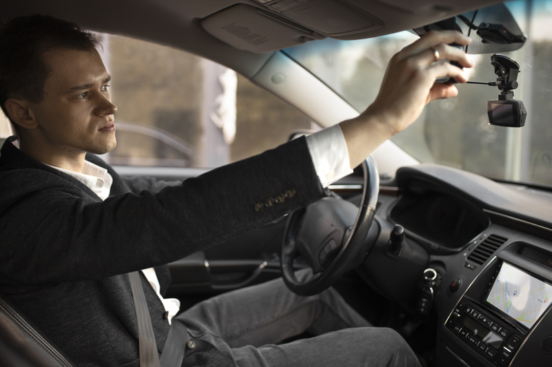 man-driving-his-elegant-car-for-taxi-services.jpg