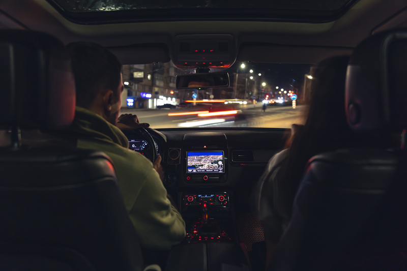 man-and-woman-in-a-car-at-night-view-from-the-car.jpg